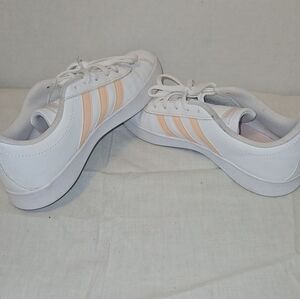 Adidas kids peach stripes sneakers.